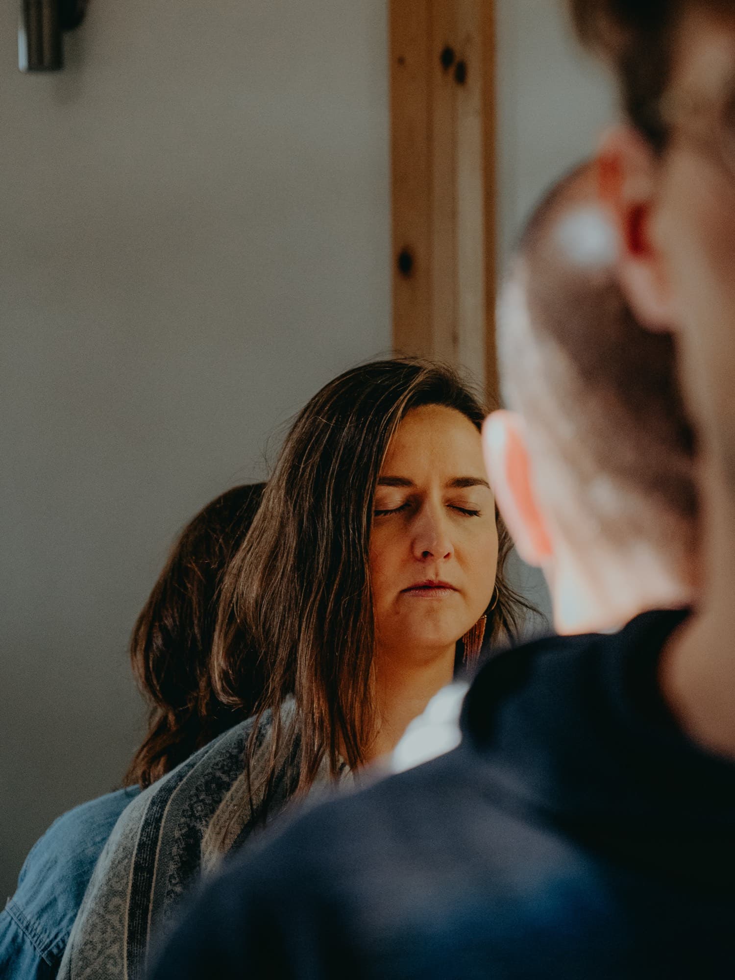 A participant with her eyes closed during inquiry